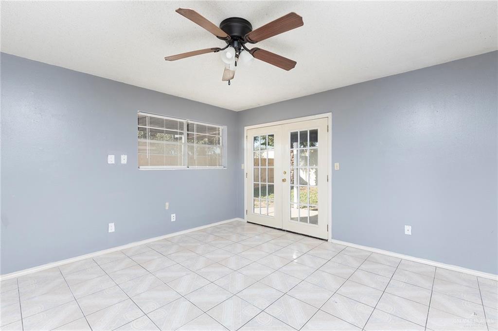 3417 North Kenyon Road Edinburg, TX 78542 - Photo 5 of 12 a view of an empty room with a window