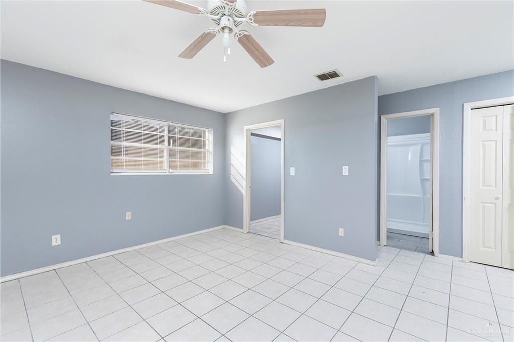3417 North Kenyon Road Edinburg, TX 78542 - Photo 7 of 12 a view of an empty room with a window