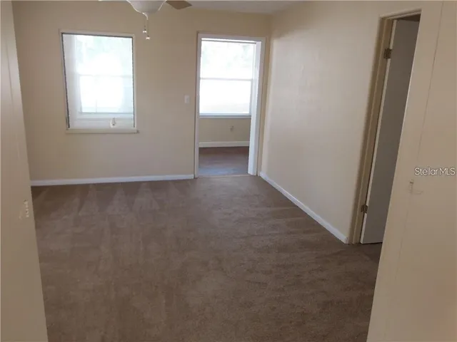 an empty room with windows