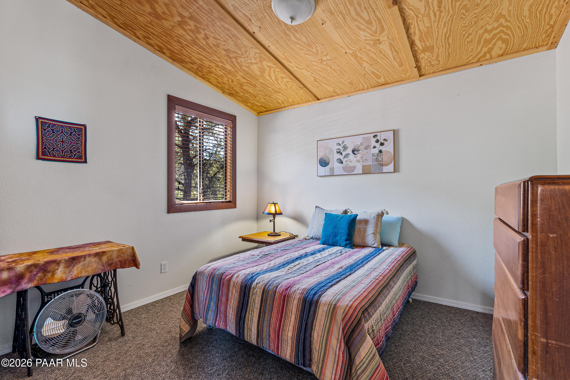 33749 West Whiskey River Road, Unit 21 Seligman, AZ 86337 - Photo 18 of 41 a bedroom with bed and a window