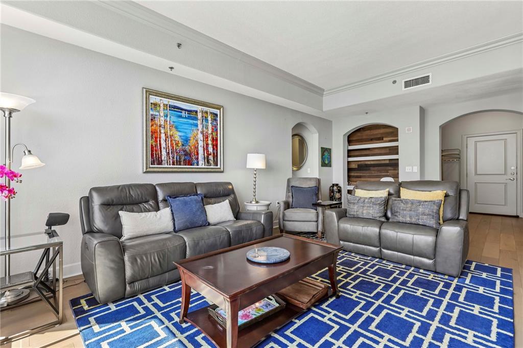 3445 Stratford Road Northeast, Unit 3105 Atlanta, GA 30326 - Photo 14 of 47 a living room with furniture and a rug