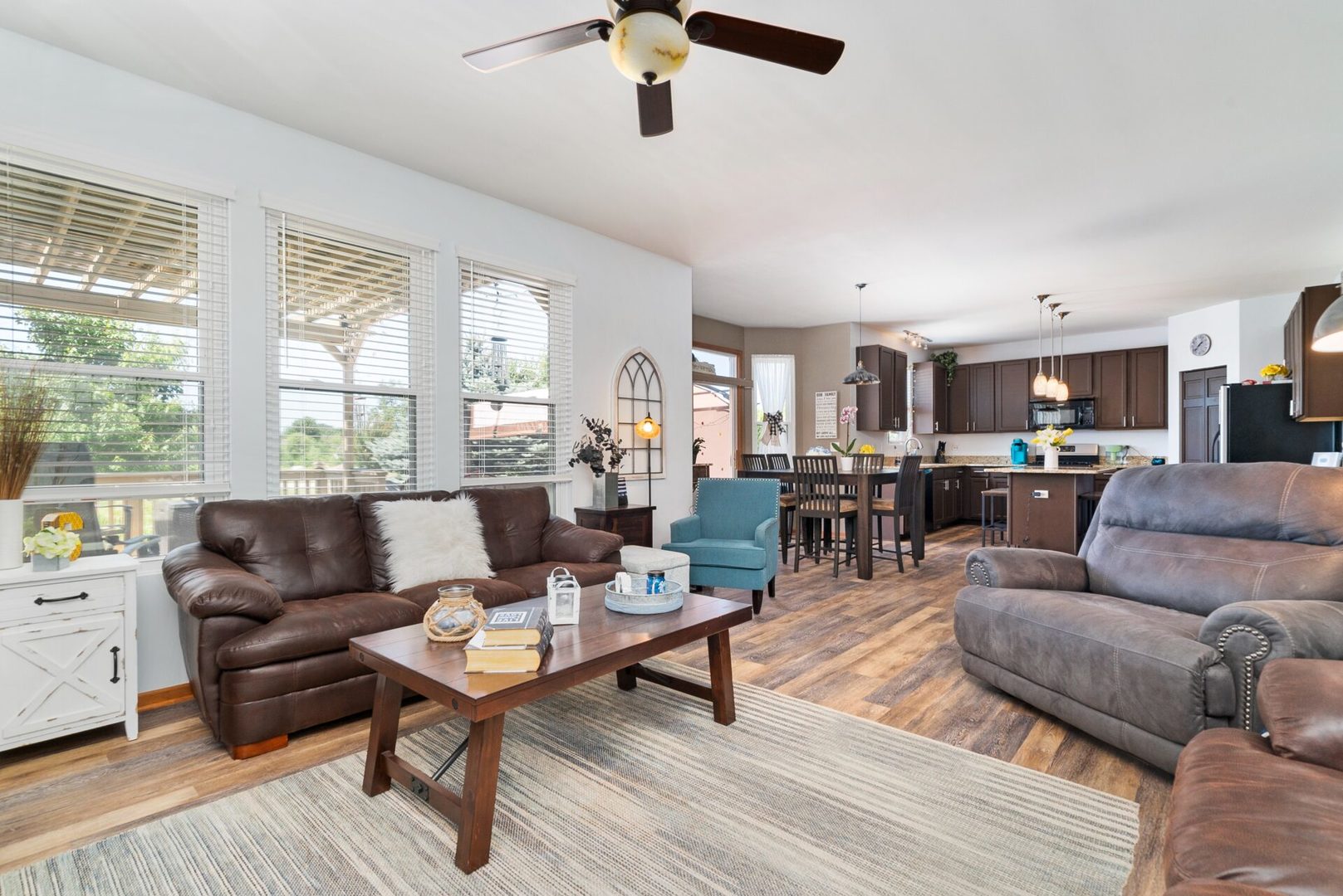 25362 Spring Street Manhattan, IL 60442 - Photo 8 of 28 a living room with furniture wooden floor and a large window