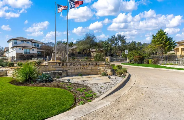 a view of a fountain in front of a house