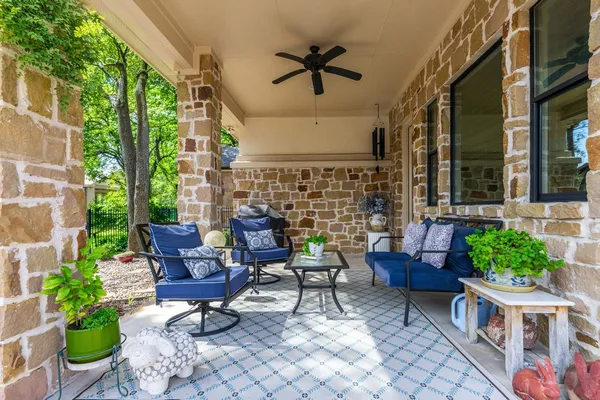 a view of a house with backyard and porch
