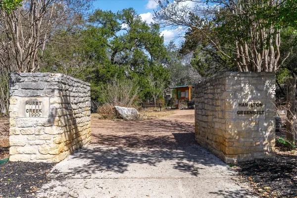 a view of a house with backyard and patio
