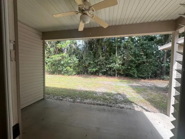 a view of a hallway with a window