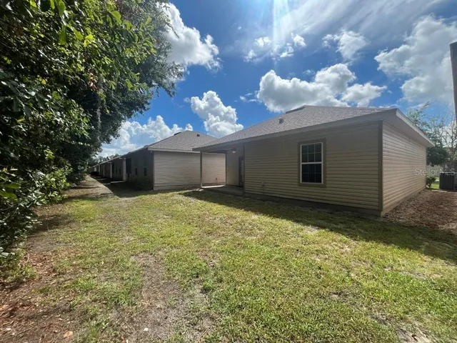 a view of house with yard
