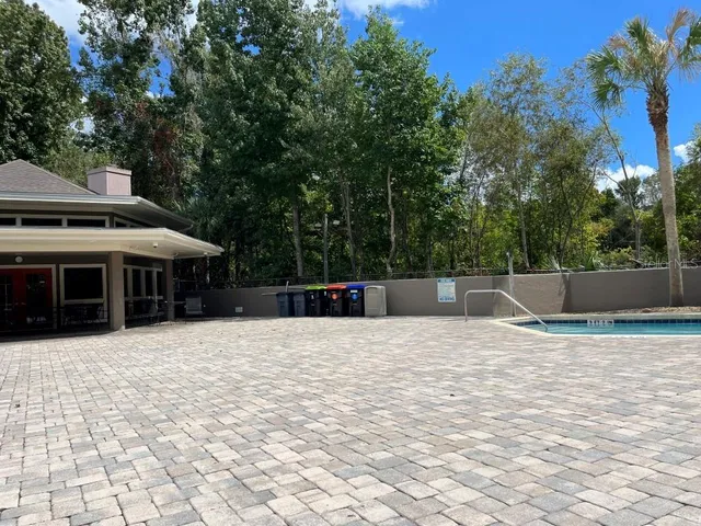 a view of a swimming pool with a lounge chairs
