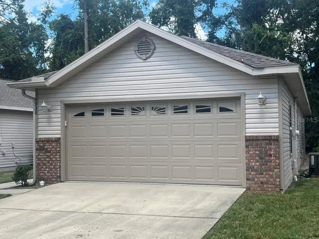a house with a tree in the yard