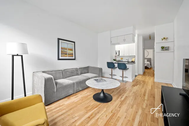 a kitchen with sink cabinets and stove top oven