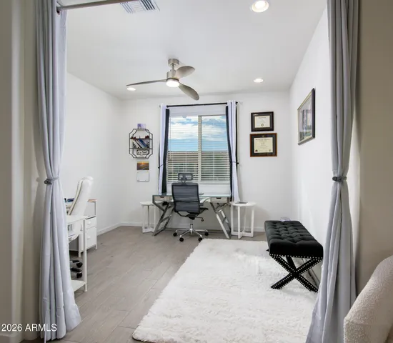 a bedroom with furniture and a window