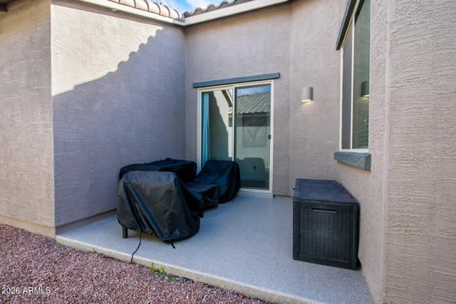 a view of a yard with furniture and a garden