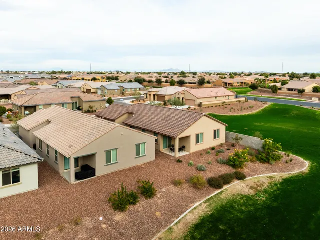 an aerial view of a house with a garden