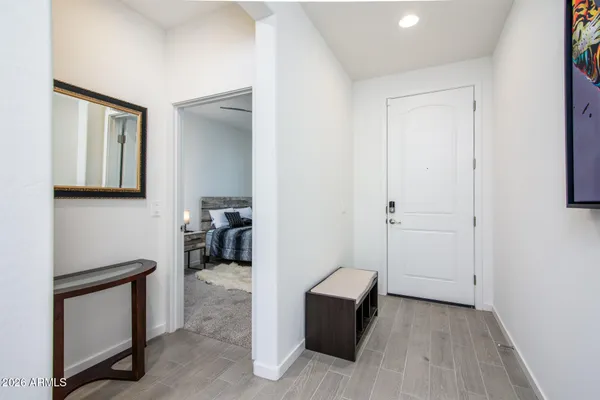 a bedroom with a bed and dresser