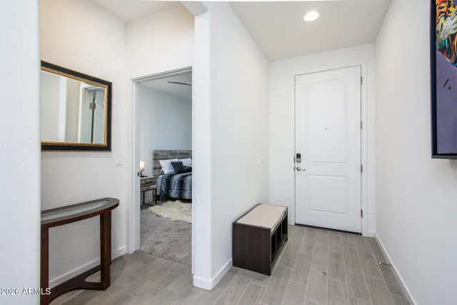 a bedroom with a bed and dresser