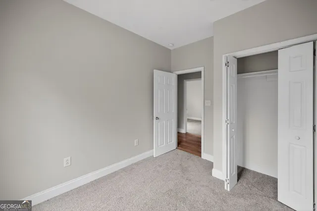 a view of a room with a hallway and a room