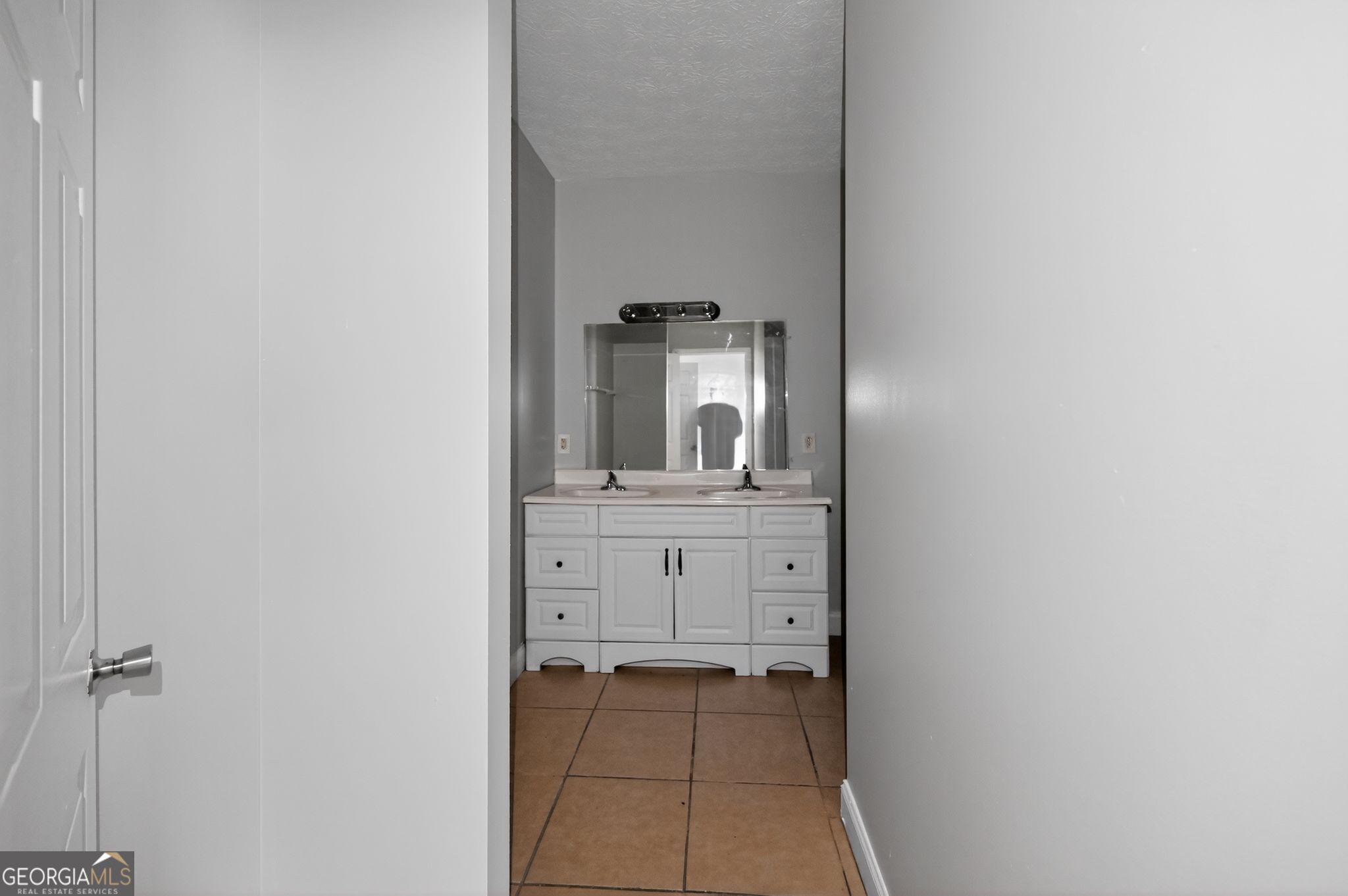607 Lane Street Griffin, GA 30223 - Photo 21 of 31 a bathroom with a sink and a mirror