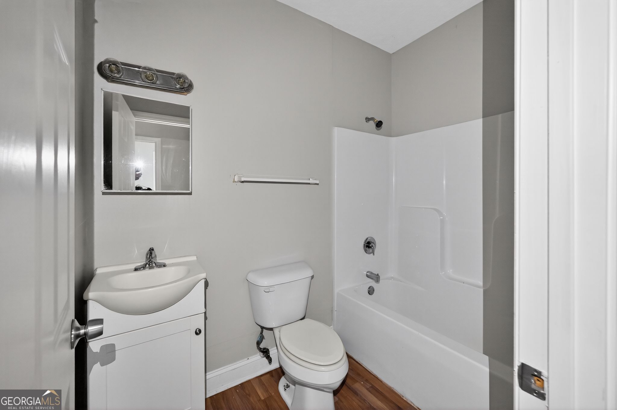 607 Lane Street Griffin, GA 30223 - Photo 22 of 31 a white toilet sitting next to a bathroom sink