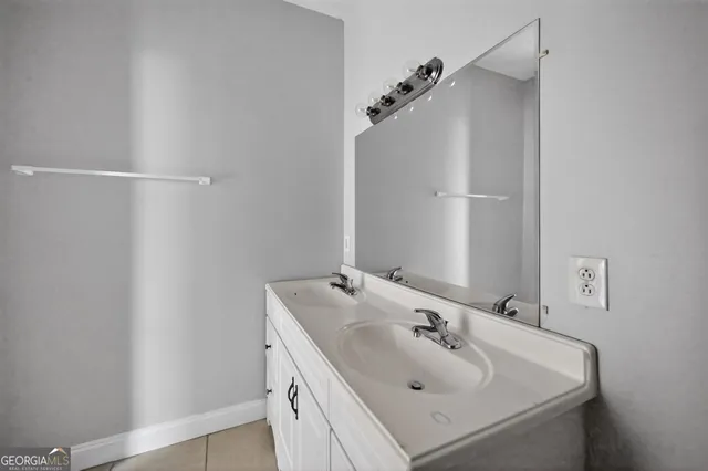 a bathroom with a sink and mirror