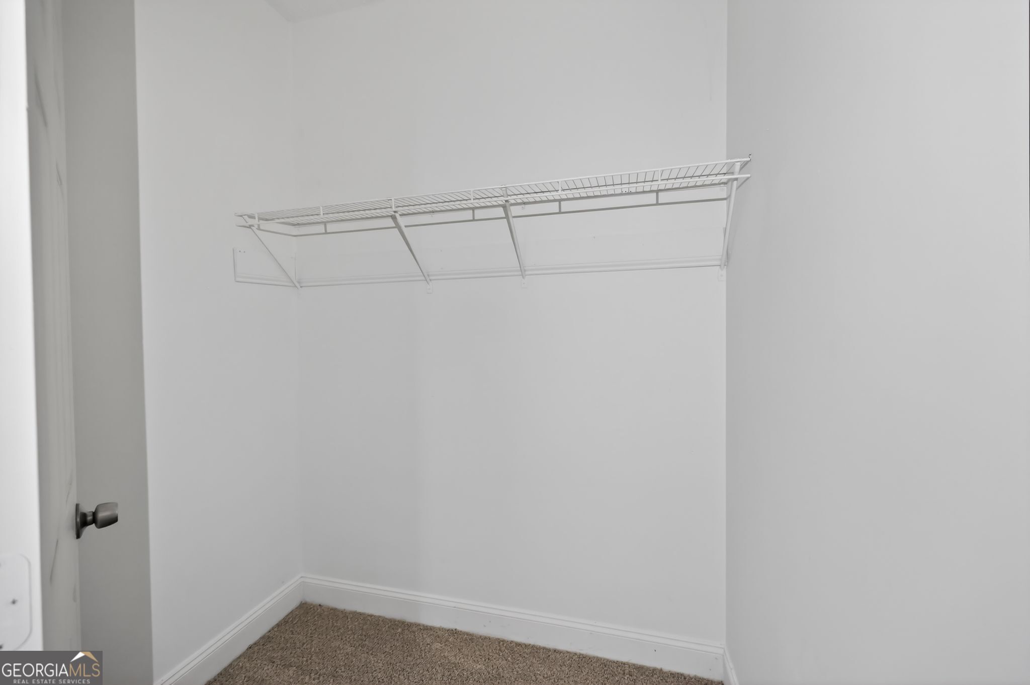 607 Lane Street Griffin, GA 30223 - Photo 28 of 31 a view of an empty walk in closet