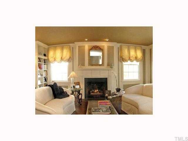 2117 St Marys Street Raleigh, NC 27608 - Photo 4 of 12 a living room with furniture and a fireplace