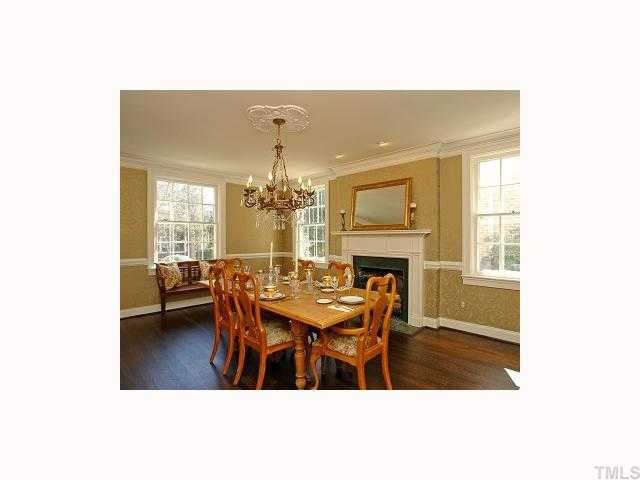 2117 St Marys Street Raleigh, NC 27608 - Photo 5 of 12 a dining room with furniture a livingroom and chandelier