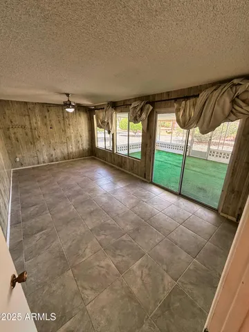 a view of a room with window and hardwood