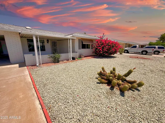 a view of a house with sitting area and furniture