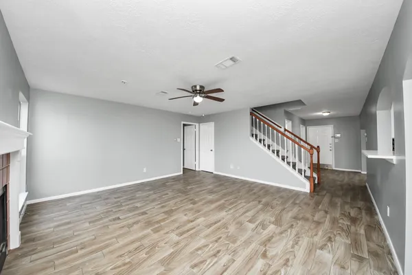 a view of an entryway with wooden floor