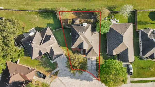 an aerial view of a house with a ocean view