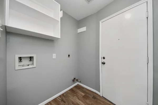 a view of small space with racks on the wall