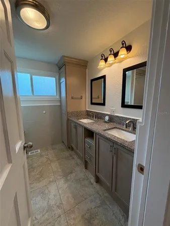 a bathroom with a sink and a mirror
