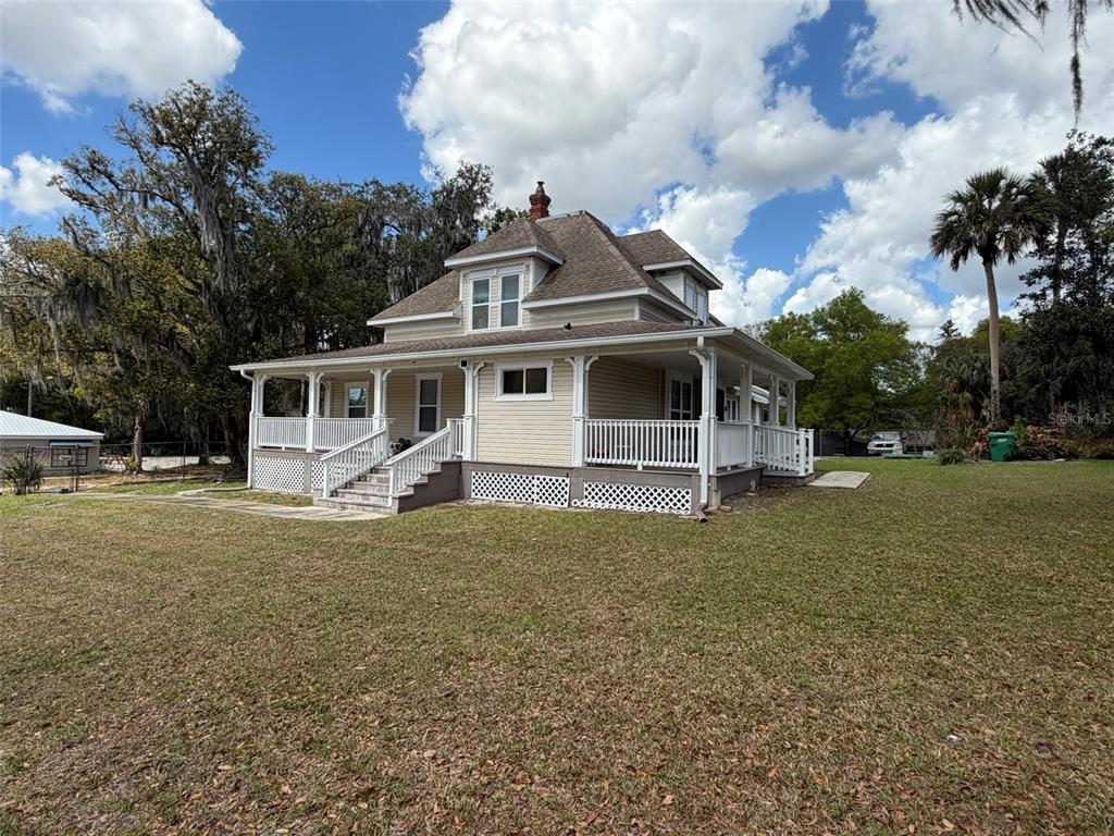 903 East New York Avenue Deland, FL 32724 - Photo 2 of 29 a view of a house with a backyard