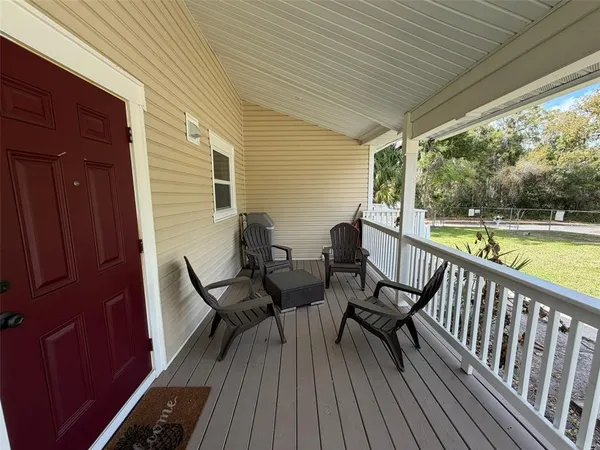 a view of a two chairs in the balcony