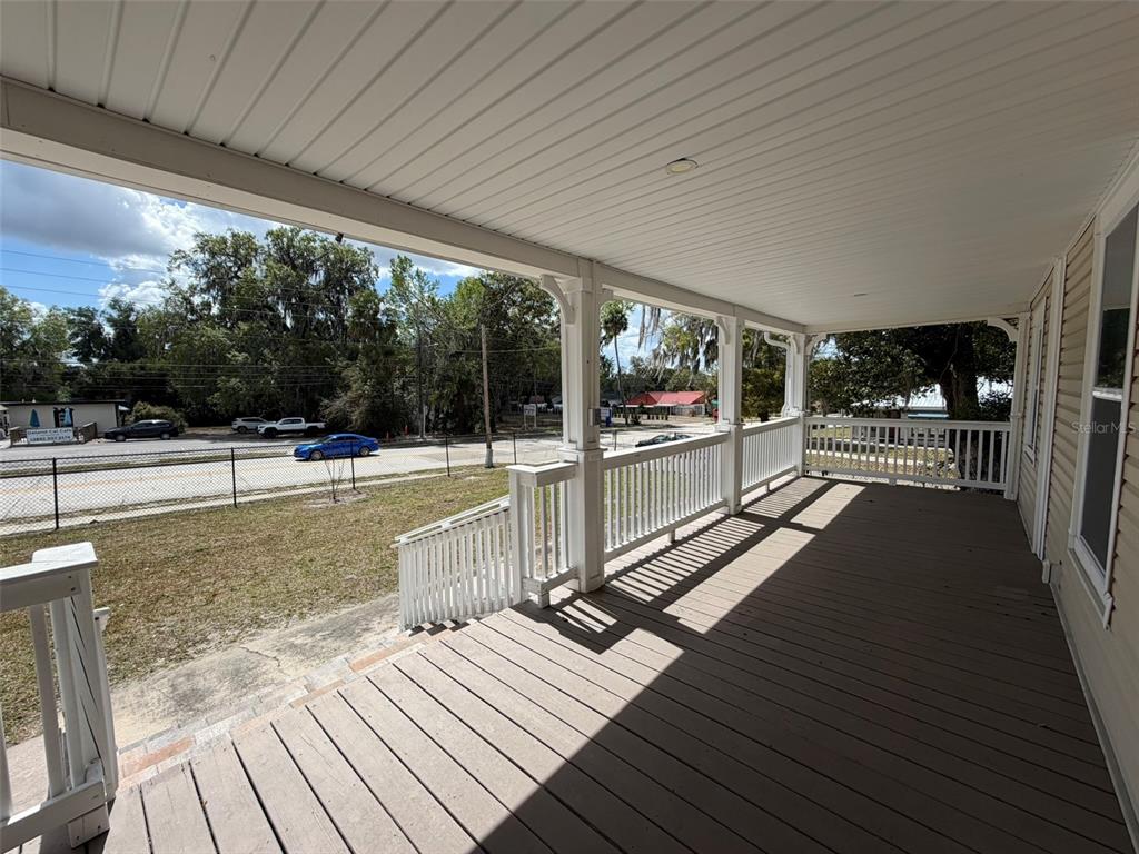 903 East New York Avenue Deland, FL 32724 - Photo 5 of 29 a view of a balcony with wooden floor