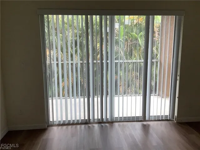 a view of outdoor space with wooden floor