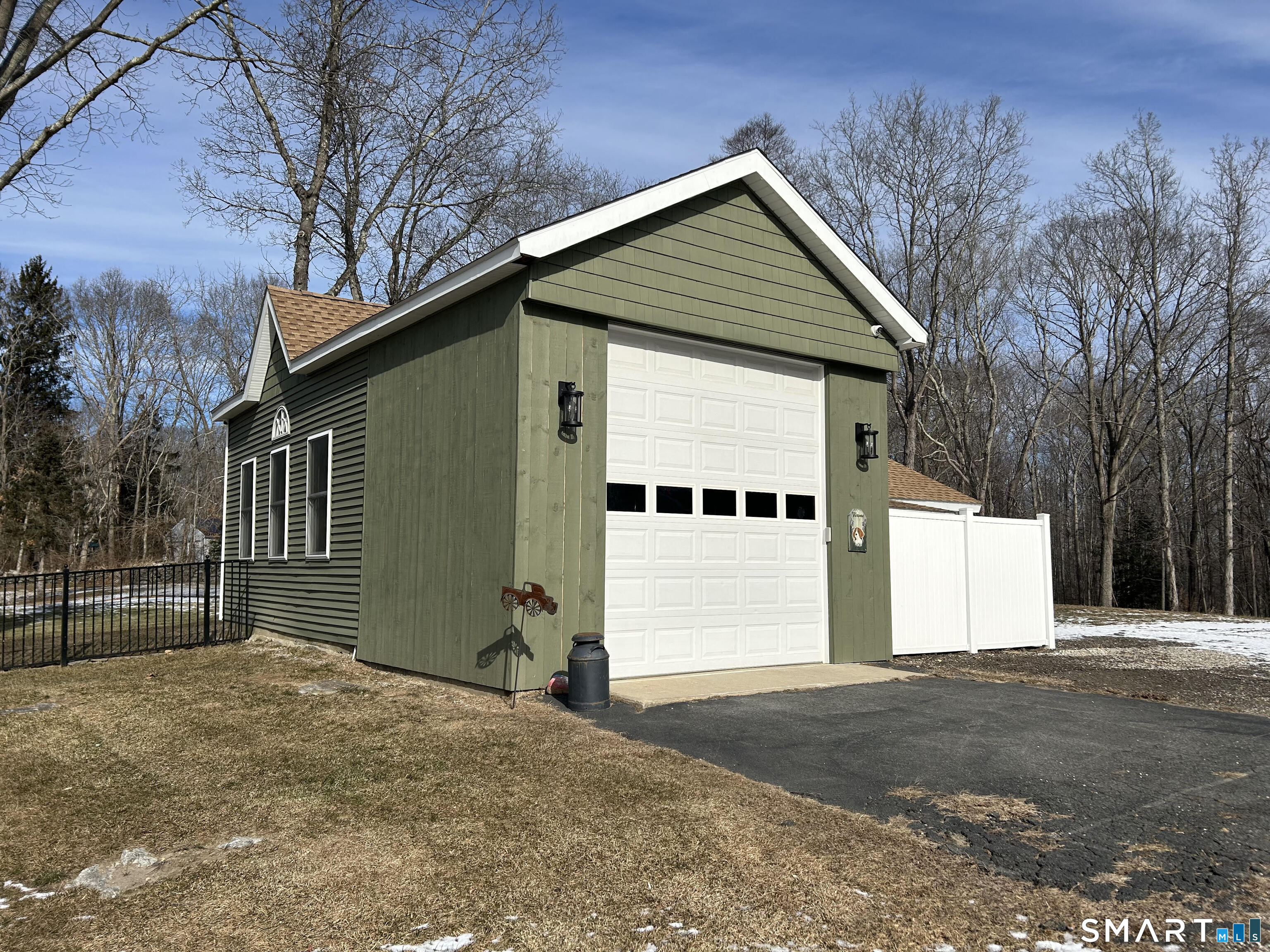 151 Bushy Hill Road Deep River, CT 06417 - Photo 30 of 32 a front view of a house with a yard and garage