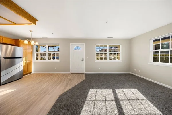 a kitchen with stainless steel appliances granite countertop a stove and a refrigerator