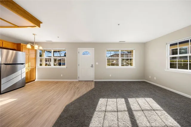 a kitchen with stainless steel appliances granite countertop a stove and a refrigerator