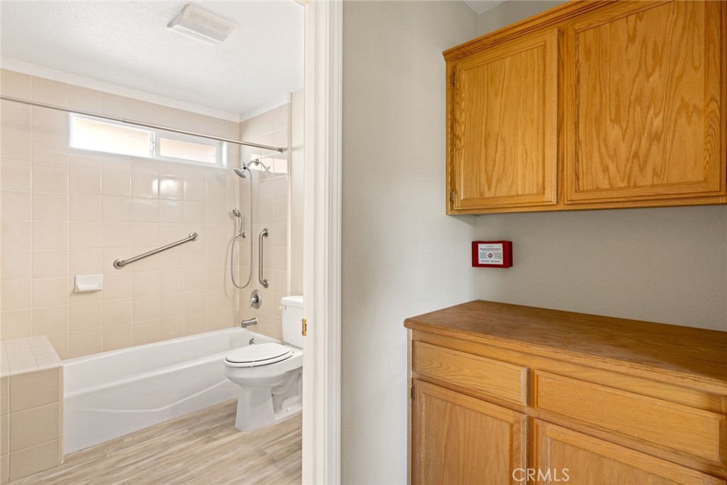 519 North Ferrocarril Road Atascadero, CA 93422 - Photo 6 of 14 Hall cabinetry sits just outside of the spacious bathroom. A stackable washer & dryer is also located in this condo.