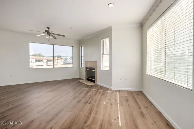 wooden floor in an empty room with a window