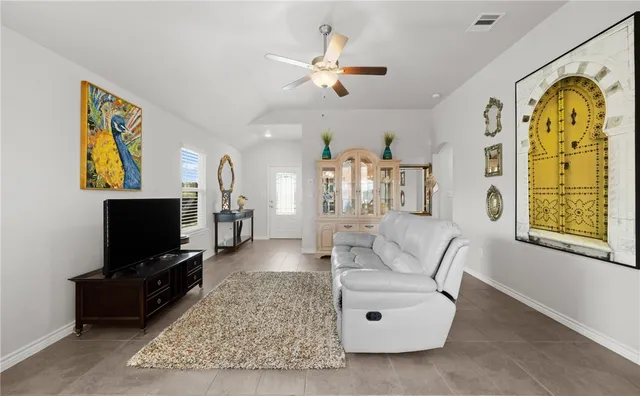 a living room with furniture and a flat screen tv