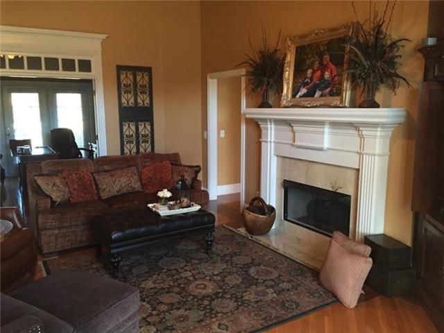 2023 Blue Ribbon Downs Lebanon, TN 37087 - Photo 6 of 20 Living Room w/ Fireplace and Hardwood Floors