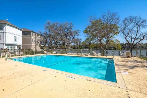 a view of swimming pool with a yard