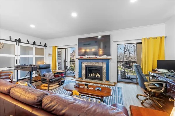 a living room with furniture and a fireplace