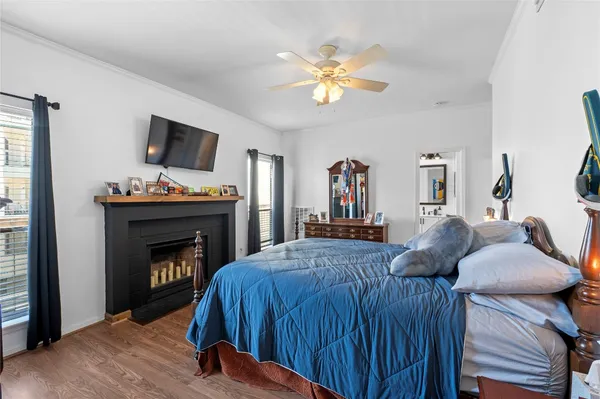 a bedroom with a bed and a fireplace