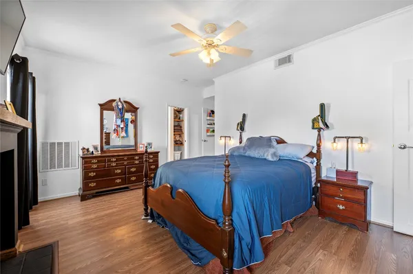 a bed room with furniture and wooden floor