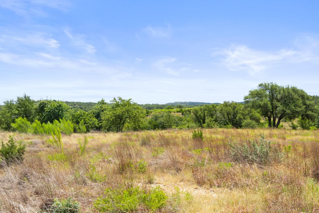 207 Verbena Road Johnson City, TX 78636 - Photo 18 of 40 Vast stretches of open land extend to the horizon, offering limitless potential for development.