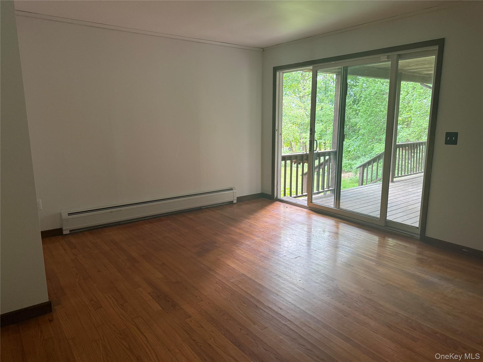 183 Barrytown Road Barrytown, NY 12507 - Photo 16 of 41 a view of a room with wooden floor and iron gate