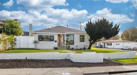 a view of a swimming pool in the backyard of house